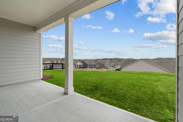 exterior space with a residential view and a patio