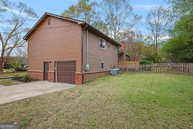3916 S Martin Way, Lithia Springs, GA 30122 - view of side of home featuring fence, an attached garage, cooling unit, a lawn, and driveway