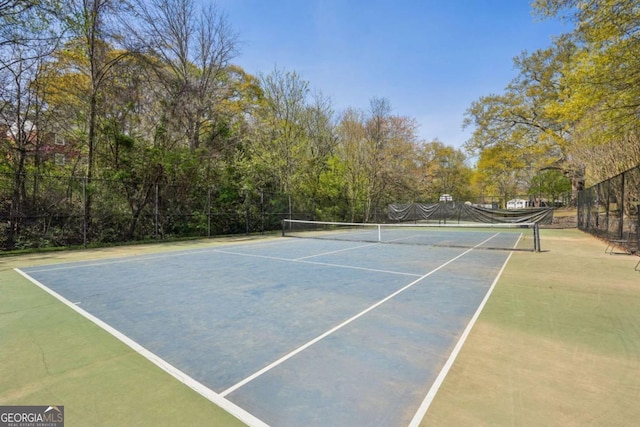 view of sport court with fence