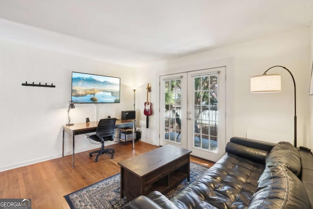 home office with french doors, wood finished floors, and baseboards
