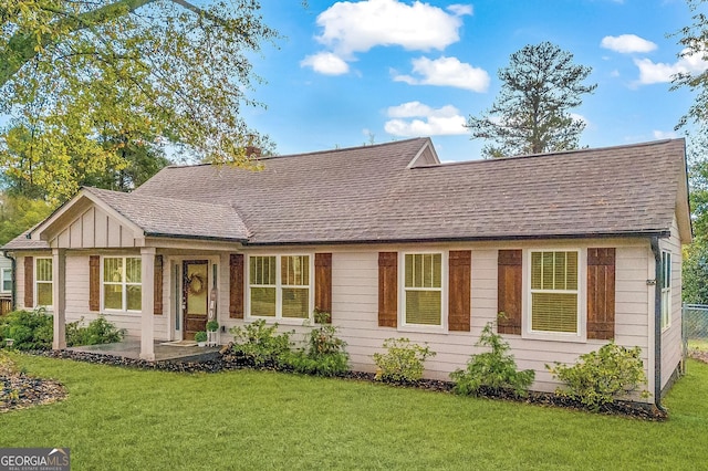 68 Hayes St, Toccoa, GA 30577 - view of front of house with a shingled roof, a front yard, and board and batten siding