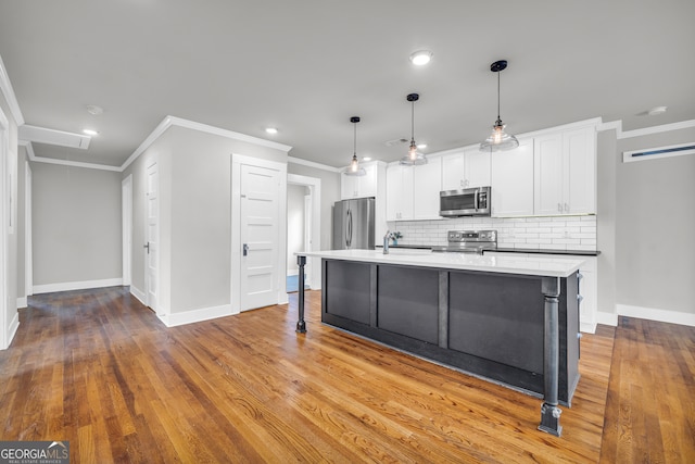 68 Hayes St, Toccoa, GA 30577 - kitchen with stainless steel appliances, ornamental molding, backsplash, baseboards, and white cabinets