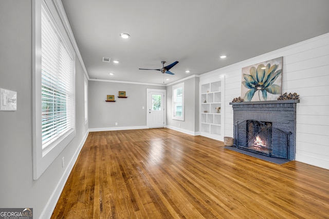 68 Hayes St, Toccoa, GA 30577 - unfurnished living room featuring a ceiling fan, ornamental molding, a brick fireplace, baseboards, and recessed lighting