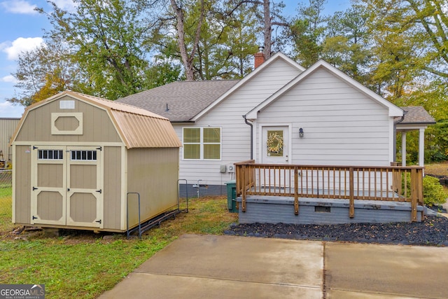 68 Hayes St, Toccoa, GA 30577 - view of front facade featuring a gambrel roof, a deck, a chimney, and a shingled roof