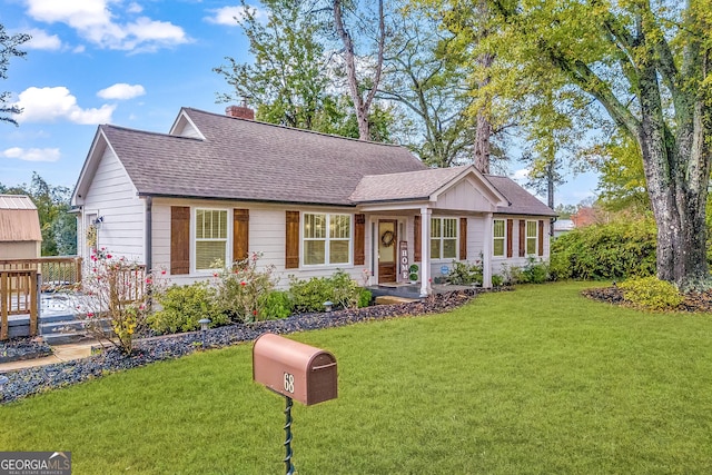 68 Hayes St, Toccoa, GA 30577 - view of front facade with a front yard, a chimney, and roof with shingles