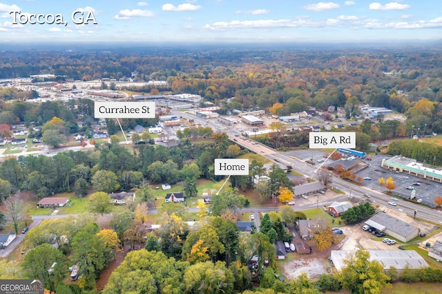 68 Hayes St, Toccoa, GA 30577 - aerial view of property and surrounding area with a heavily wooded area