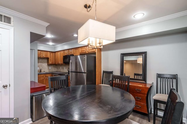 771 Jordan Ln Unit K, Decatur, GA 30033 - dining room with crown molding and wood finished floors