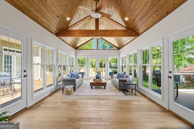 sunroom featuring high vaulted ceiling, french doors, visible vents, and hardwood / wood-style floors