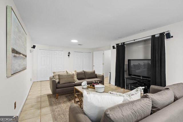 living area with recessed lighting, light tile patterned floors, and baseboards
