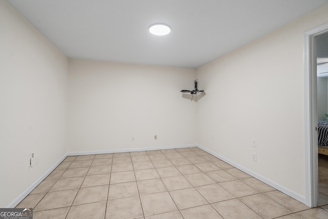 empty room featuring baseboards