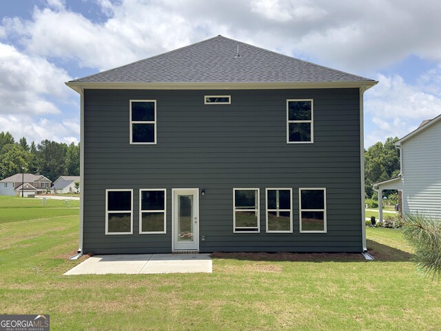 105 Hunts Mill Cir, Griffin, GA 30224 - rear view of property with a patio area, a yard, and a shingled roof