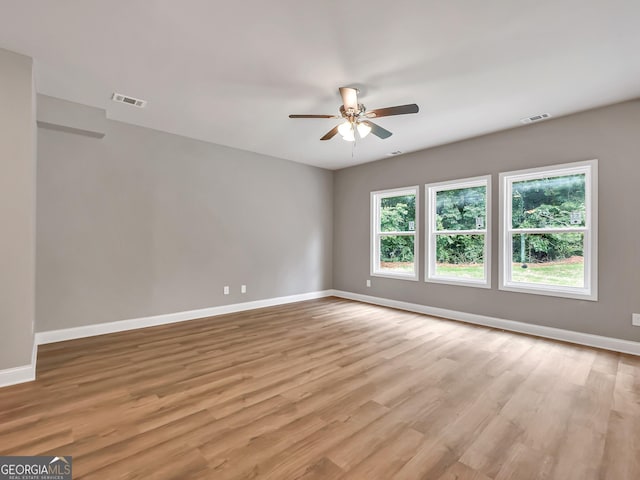 105 Hunts Mill Cir, Griffin, GA 30224 - empty room with ceiling fan and light wood-style floors