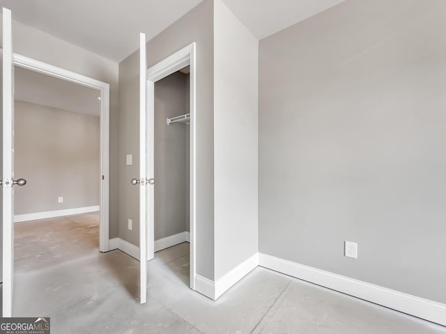 105 Hunts Mill Cir, Griffin, GA 30224 - unfurnished bedroom with concrete flooring and a closet
