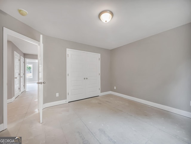 105 Hunts Mill Cir, Griffin, GA 30224 - unfurnished bedroom with baseboards and a closet