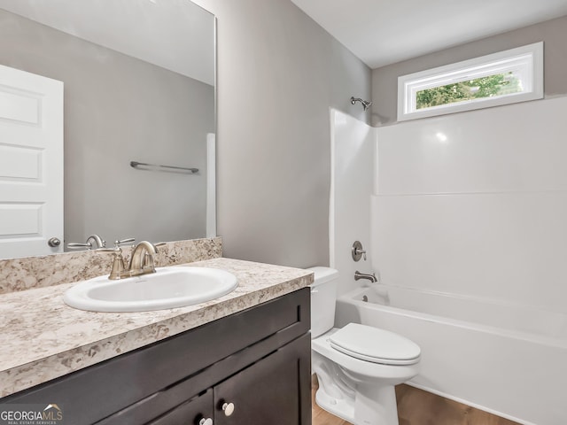 105 Hunts Mill Cir, Griffin, GA 30224 - full bath with vanity, wood finished floors, and bathtub / shower combination