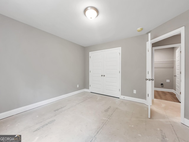 105 Hunts Mill Cir, Griffin, GA 30224 - unfurnished bedroom featuring a closet and baseboards