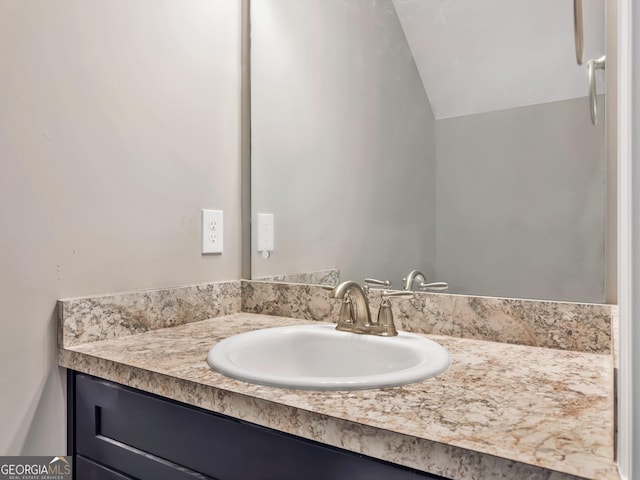 105 Hunts Mill Cir, Griffin, GA 30224 - bathroom with vanity and vaulted ceiling