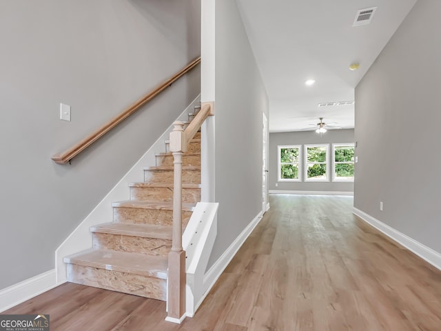 105 Hunts Mill Cir, Griffin, GA 30224 - staircase with wood finished floors, a ceiling fan, and recessed lighting