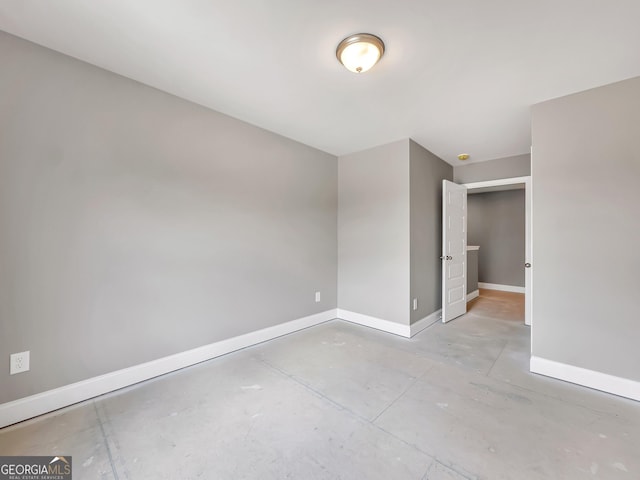 105 Hunts Mill Cir, Griffin, GA 30224 - spare room with baseboards and concrete floors