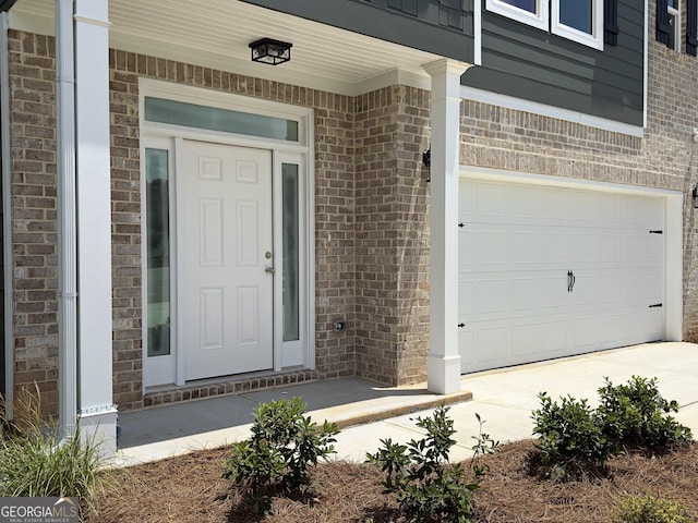 105 Hunts Mill Cir, Griffin, GA 30224 - entrance to property featuring brick siding, driveway, and an attached garage