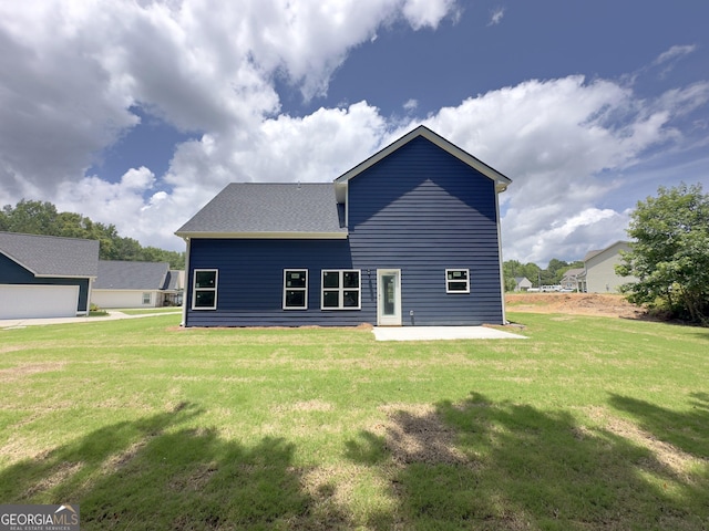 131 Hunts Mill Cir, Griffin, GA 30224 - back of property with a yard, a patio, and roof with shingles