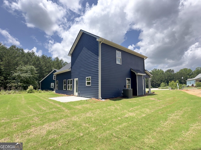 131 Hunts Mill Cir, Griffin, GA 30224 - view of side of home with a patio area and a yard