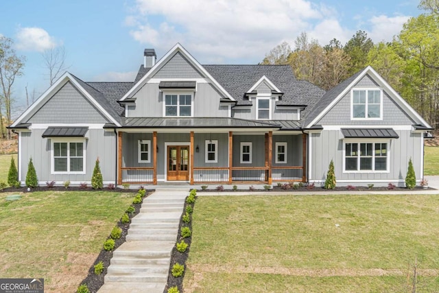 view of front facade featuring french doors, board and batten siding, a standing seam roof, and metal roof