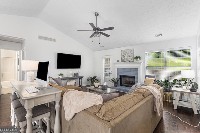 287 Players Cir, Fayetteville, GA 30215 - living area with dark wood-style flooring, visible vents, a fireplace, ceiling fan, and vaulted ceiling