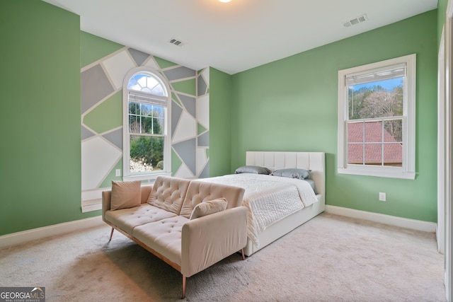 bedroom featuring baseboards, carpet flooring, and visible vents