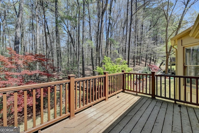 wooden terrace with a forest view