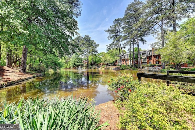 surrounding community featuring a water view