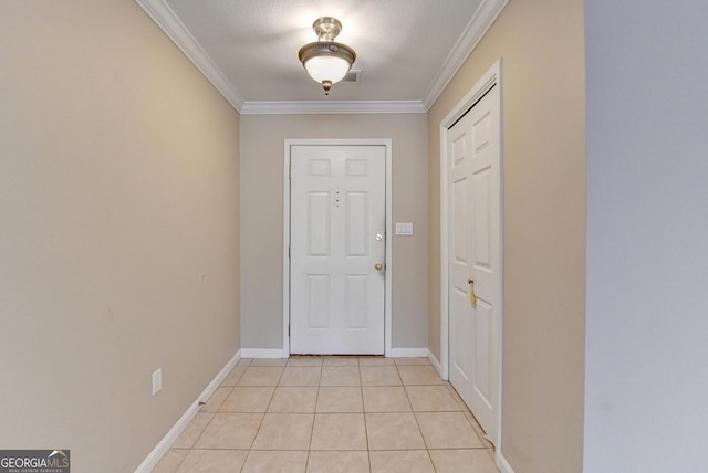 doorway to outside with light tile patterned floors, ornamental molding, baseboards, and visible vents