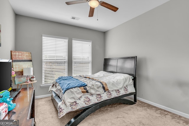 bedroom with baseboards, visible vents, a ceiling fan, and carpet floors