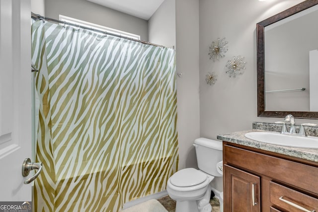 full bath with toilet and vanity