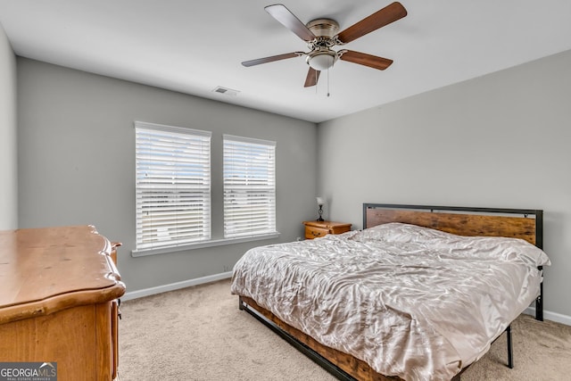 bedroom with a ceiling fan, visible vents, carpet, and baseboards