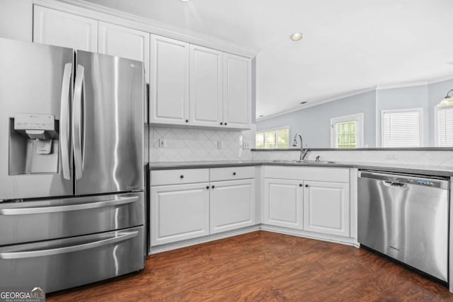 4522 Willow Oak Trl, Powder Springs, GA 30127 - kitchen with white cabinets, tasteful backsplash, dark wood-type flooring, appliances with stainless steel finishes, and a sink