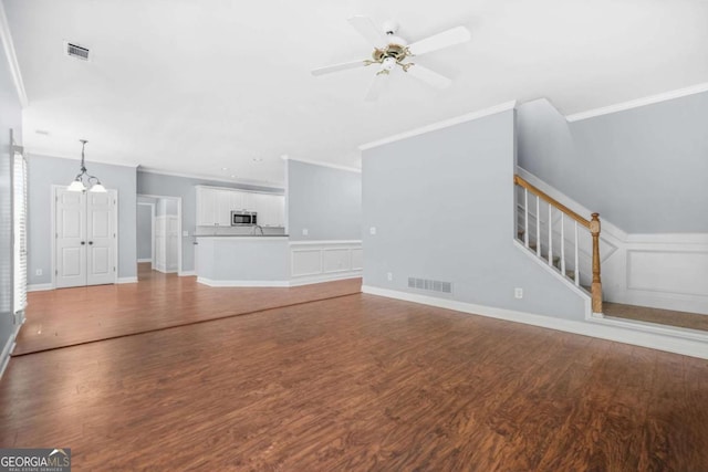 4522 Willow Oak Trl, Powder Springs, GA 30127 - unfurnished living room with visible vents, wood finished floors, ornamental molding, and a ceiling fan
