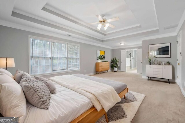 4522 Willow Oak Trl, Powder Springs, GA 30127 - bedroom featuring crown molding, baseboards, a ceiling fan, light carpet, and a raised ceiling