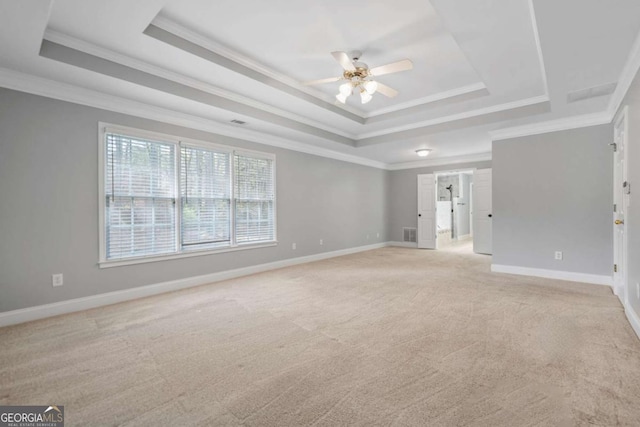 4522 Willow Oak Trl, Powder Springs, GA 30127 - empty room with crown molding, baseboards, a ceiling fan, light carpet, and a raised ceiling