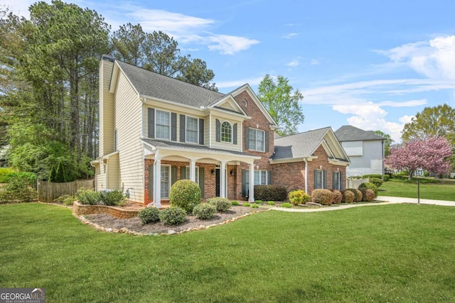 4522 Willow Oak Trl, Powder Springs, GA 30127 - colonial inspired home featuring brick siding, fence, and a front lawn