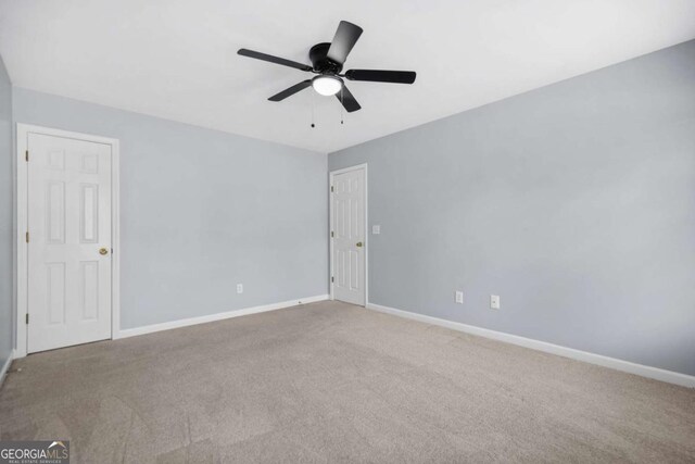 4522 Willow Oak Trl, Powder Springs, GA 30127 - carpeted empty room featuring baseboards and ceiling fan