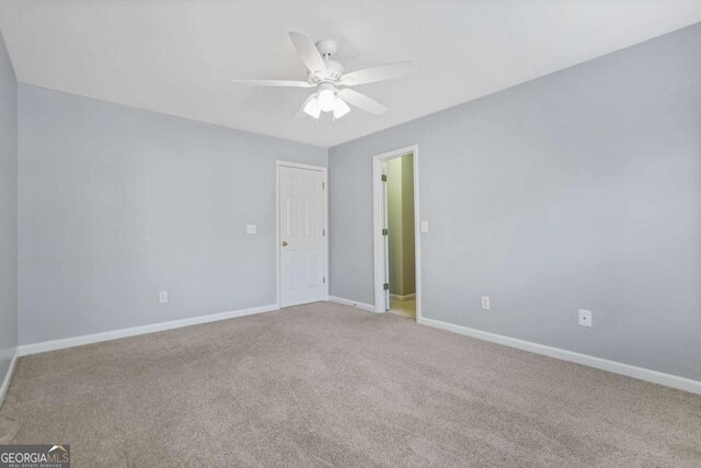 4522 Willow Oak Trl, Powder Springs, GA 30127 - empty room with baseboards, ceiling fan, and carpet flooring