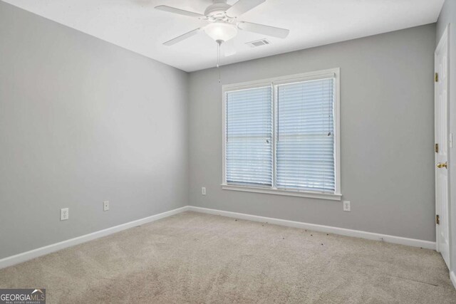 4522 Willow Oak Trl, Powder Springs, GA 30127 - spare room featuring baseboards, visible vents, ceiling fan, and carpet flooring