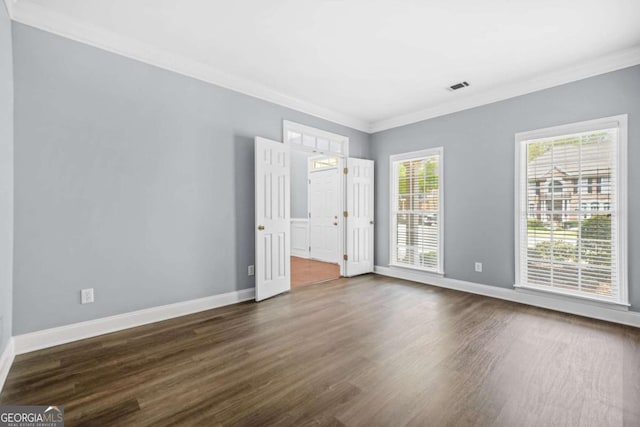 4522 Willow Oak Trl, Powder Springs, GA 30127 - empty room featuring ornamental molding, dark wood-style floors, baseboards, and visible vents