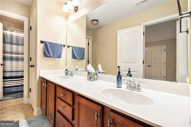 7497 Treehouse Ct, Douglasville, GA 30135 - full bath with double vanity, visible vents, and a sink
