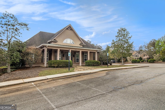 7497 Treehouse Ct, Douglasville, GA 30135 - view of front facade with a porch and uncovered parking