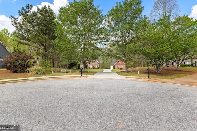 view of road with sidewalks and curbs