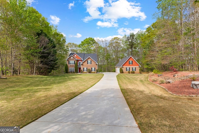 view of front facade with driveway and a front lawn
