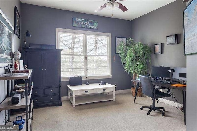 office with baseboards, ceiling fan, and light carpet