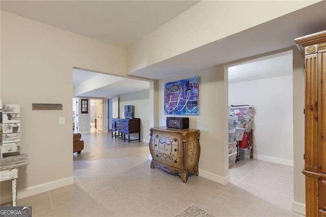 corridor featuring baseboards